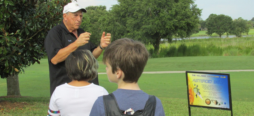 Member Burt Salk guides a tour of the Solar Walk.